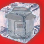 Instant Pot inside a cube in front red background